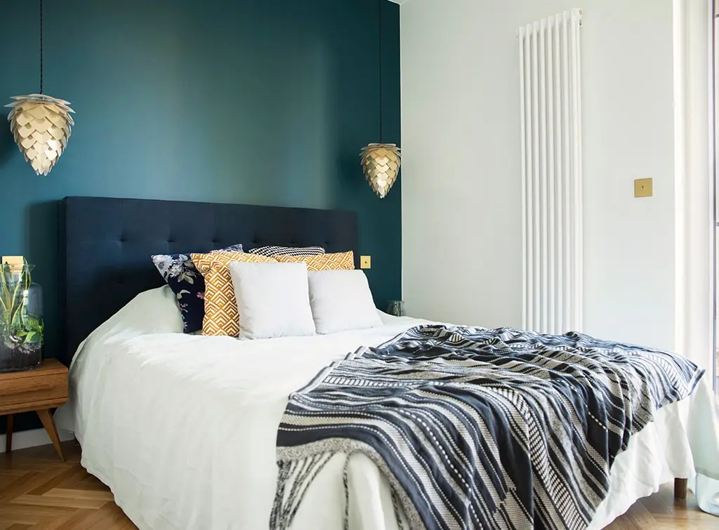 teal bedroom with pendant lights