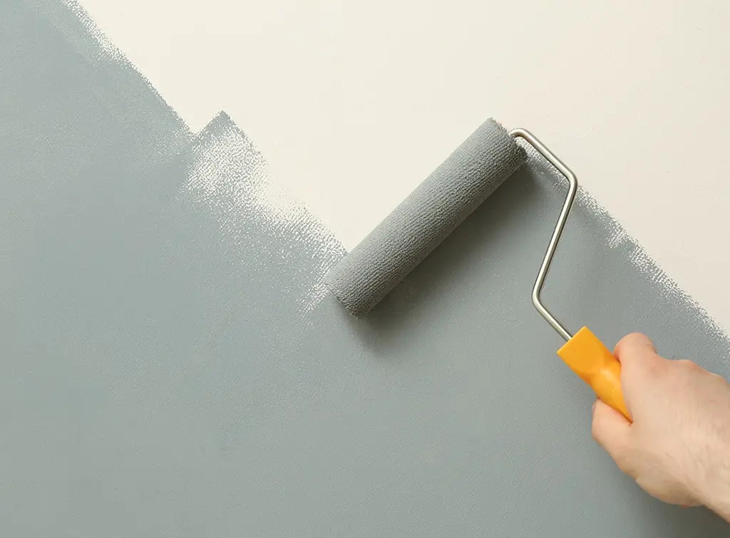 https://www.checkatrade.com/blog/wp-content/uploads/2023/09/grey-paint-with-decorator.jpg