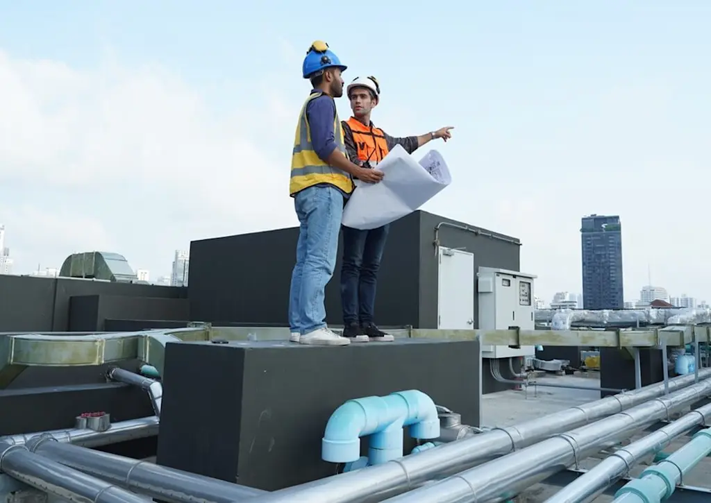 Surveying roof of tower block