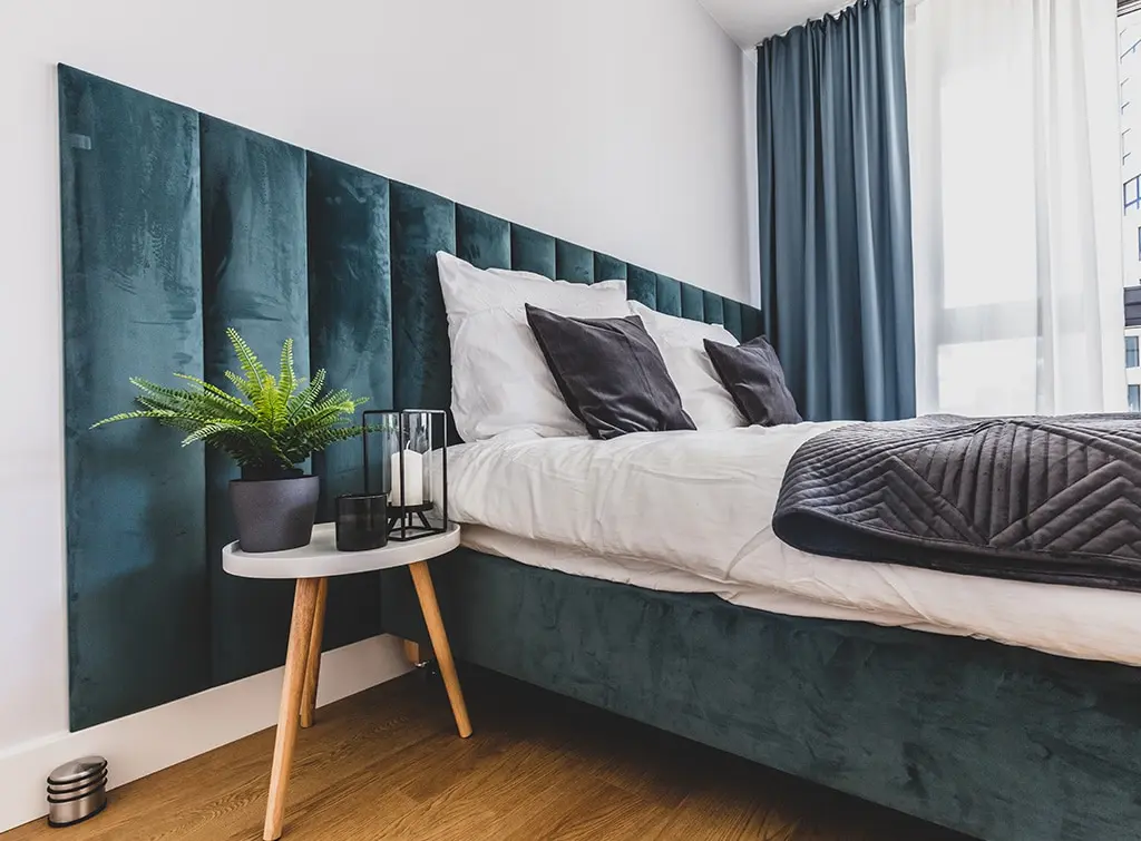Oversized headboard bedroom wall idea