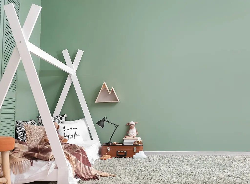 sage green walls and grey carpet