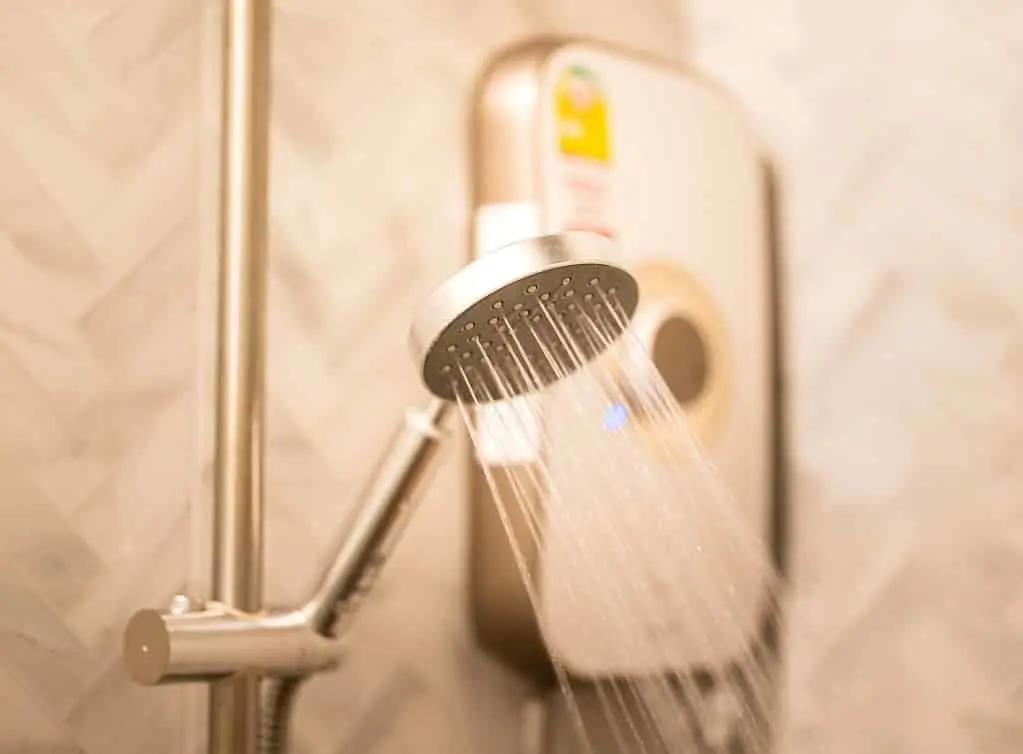 https://www.checkatrade.com/blog/wp-content/uploads/2024/12/electric-shower-installed-in-bathroom.jpeg