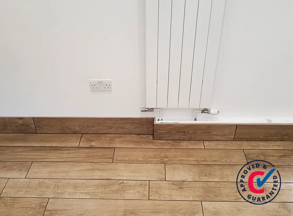 Wood effect tiled skirting board by [GR Tiling](https://www