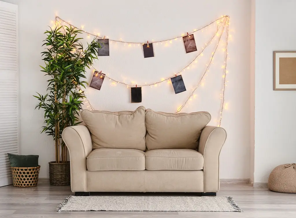 fairy lights on living room wall
