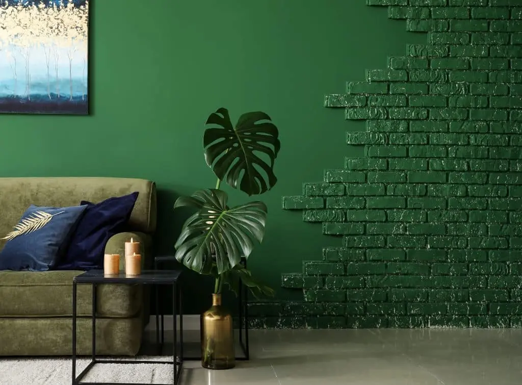 Green paint and brickwork effect for living room mural