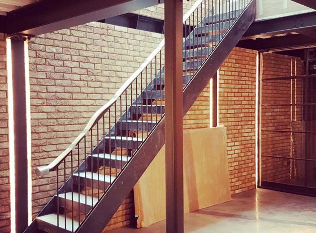 Metal staircase by [The Atelier](https://www