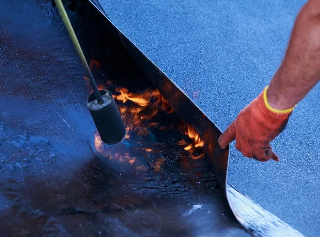 https://www.checkatrade.com/blog/wp-content/uploads/2025/03/flat-roof-repair-in-the-local-area.jpeg