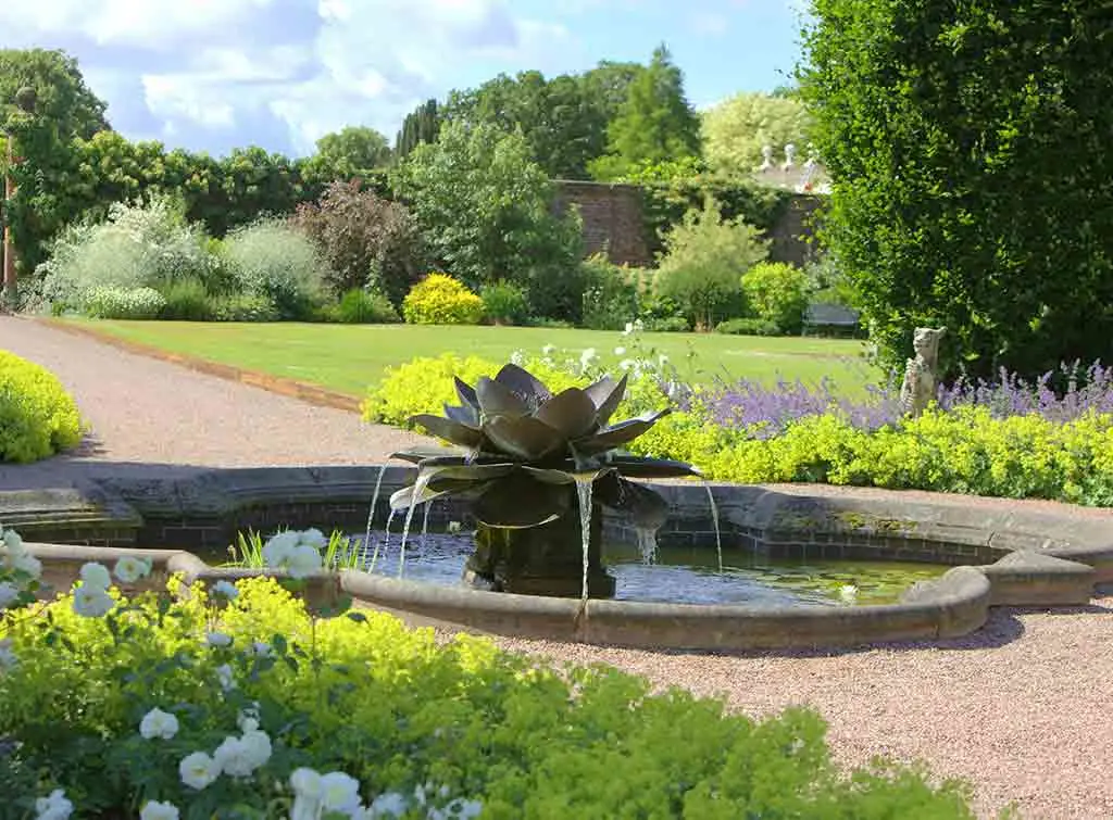 https://www.checkatrade.com/blog/wp-content/uploads/2021/04/Raised-garden-pond-ideas-4.jpg