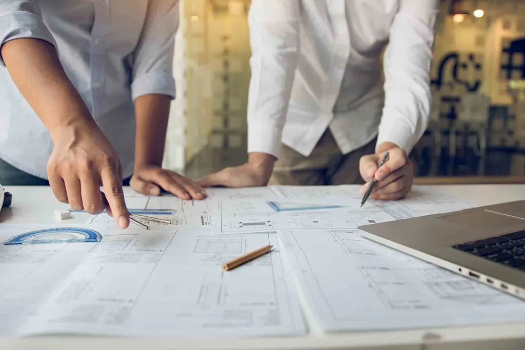 Renovation specialists reviewing plans