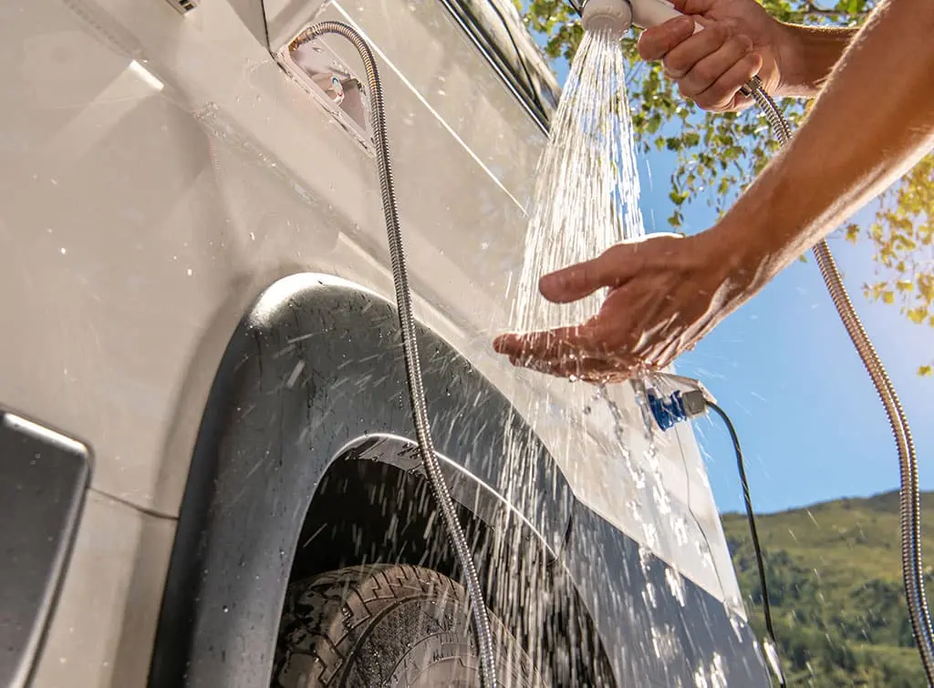 outdoor solar shower in camper van conversion