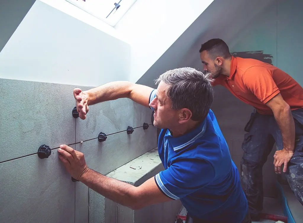 https://www.checkatrade.com/blog/wp-content/uploads/2023/09/tiling-training.jpg