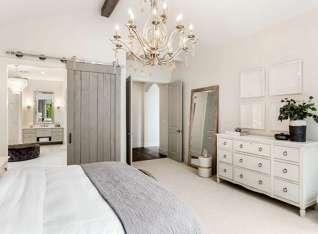 Pale grey wood barn door into a dressing room