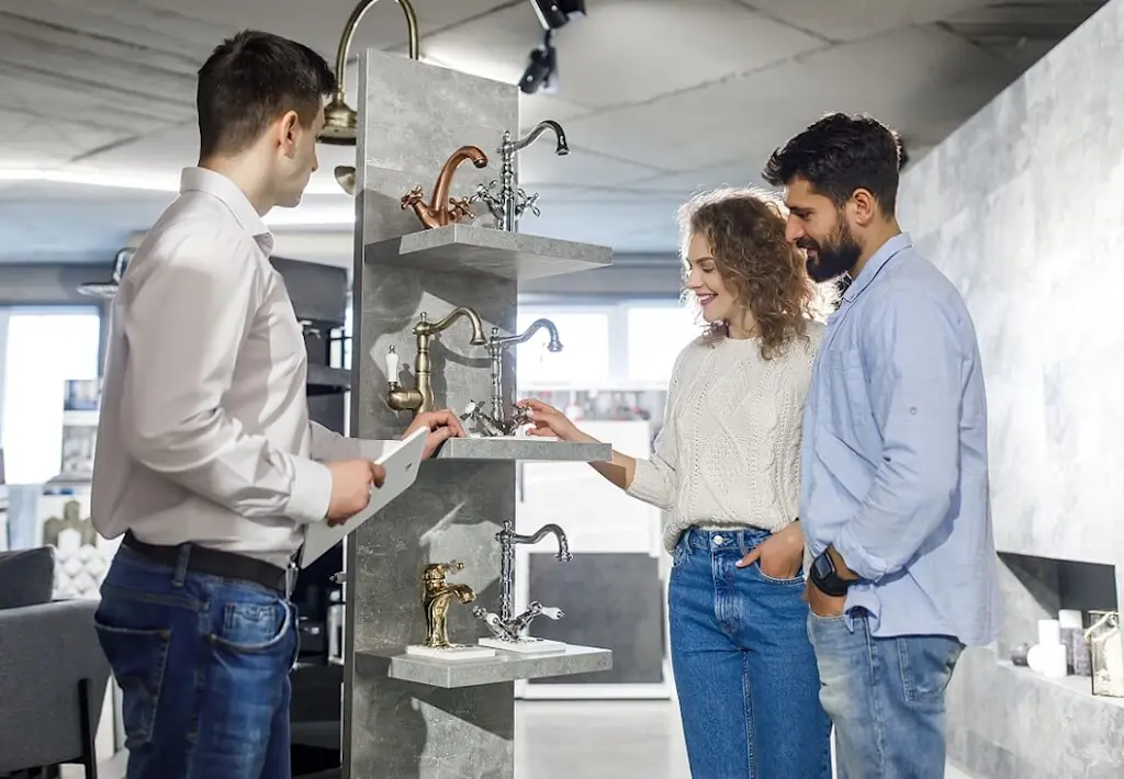 salesperson in bathroom showroom