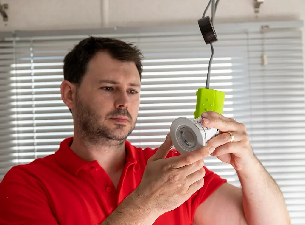 https://www.checkatrade.com/blog/wp-content/uploads/2024/10/signing-up-for-electrotechnical-certifcation-scheme.jpg