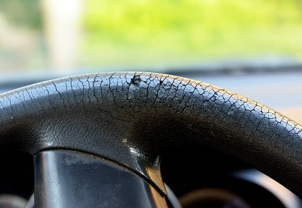 Leather steering wheel cover needs repair