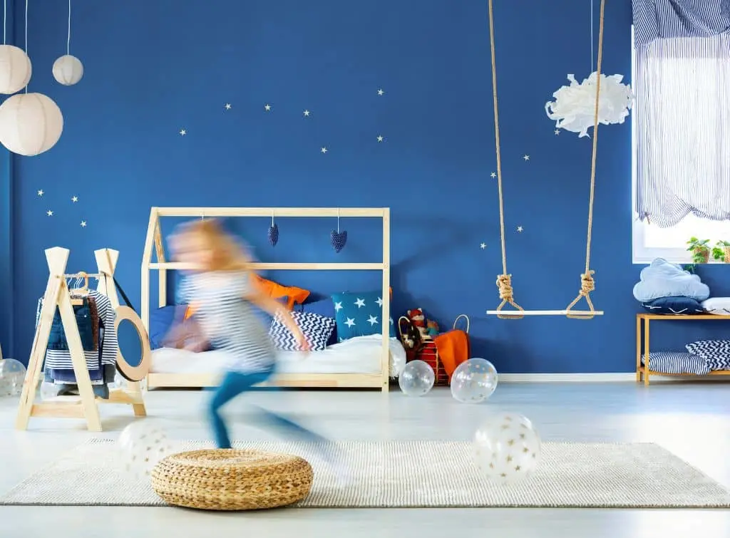 Kid zooming around his adventure themed bedroom