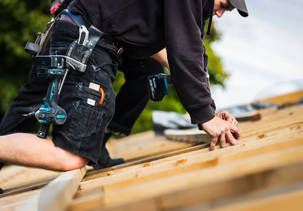 Roofer working on truss roof