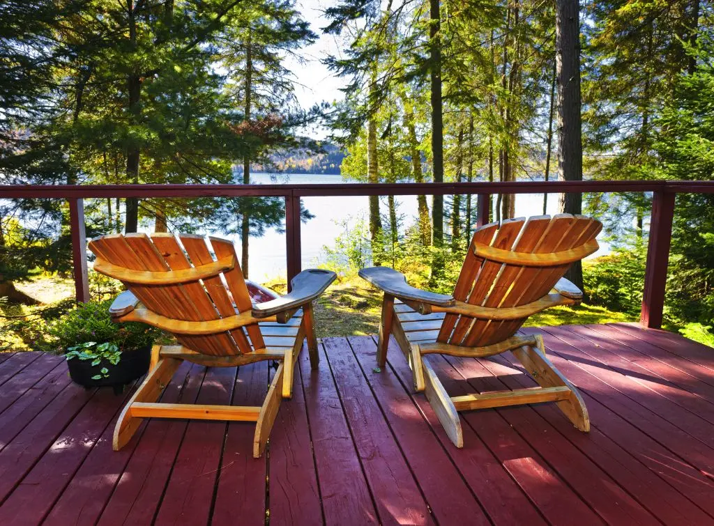 Bold and beautiful red decking overlooking a tranquil forest