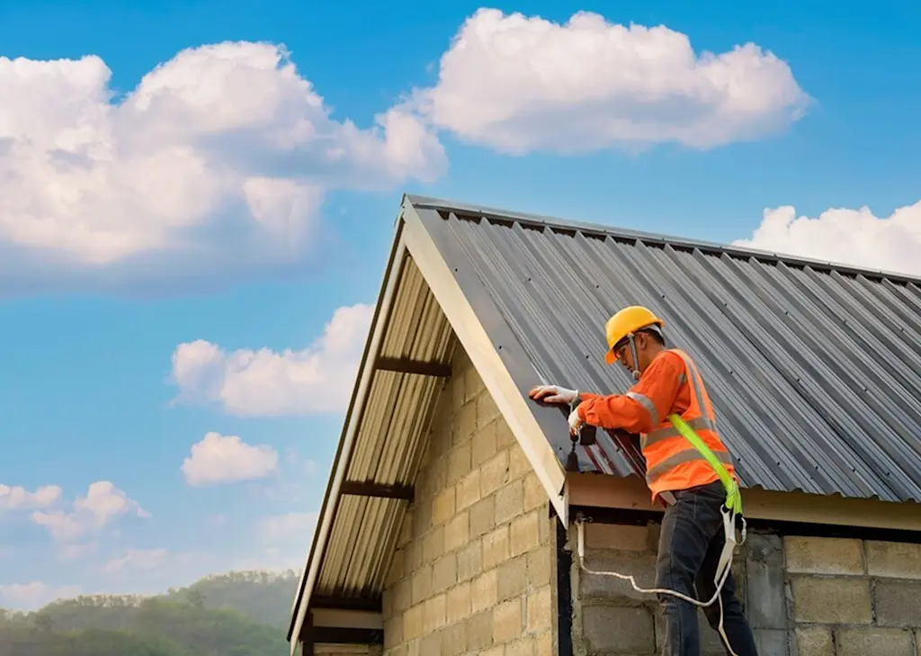 Tradesperson installing a metal roof