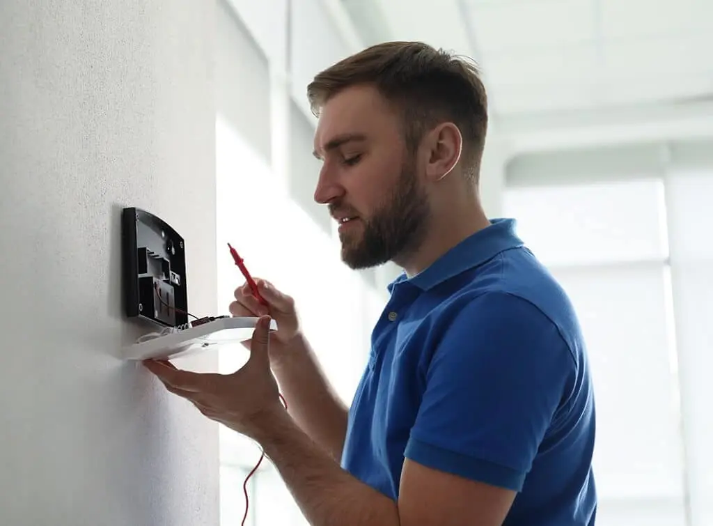 https://www.checkatrade.com/blog/wp-content/uploads/2024/11/installing-home-security-system.jpeg