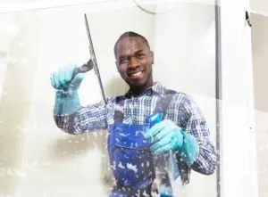 Professional window cleaner at work