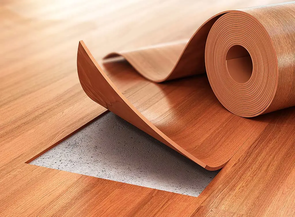 Kitchen floor makeover ideas - A roll of warm brown linoleum on matching floor with a square cut out