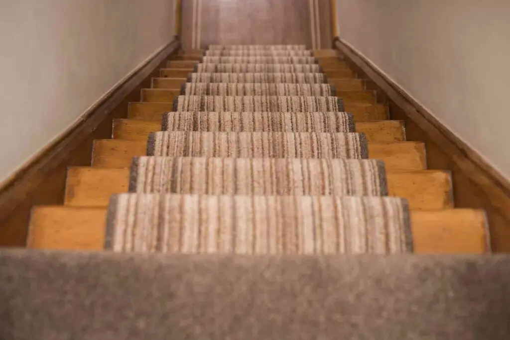 Neutral stiped stair carpet