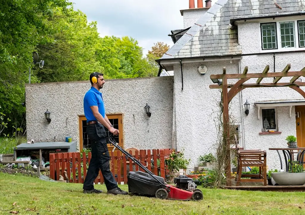 mowing a lawn tradesperson