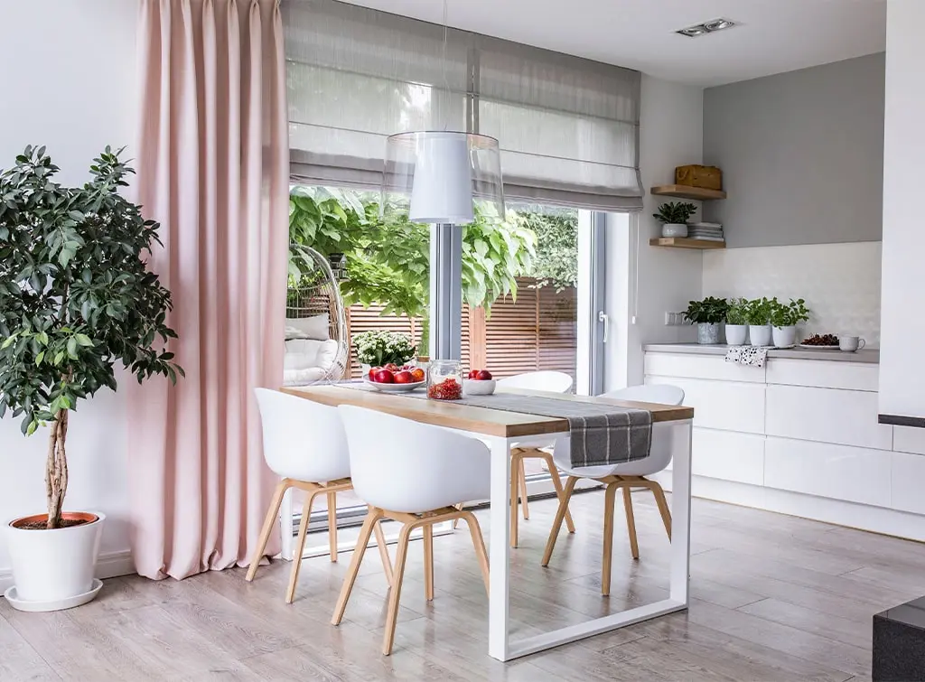 Dining room with pink curtains