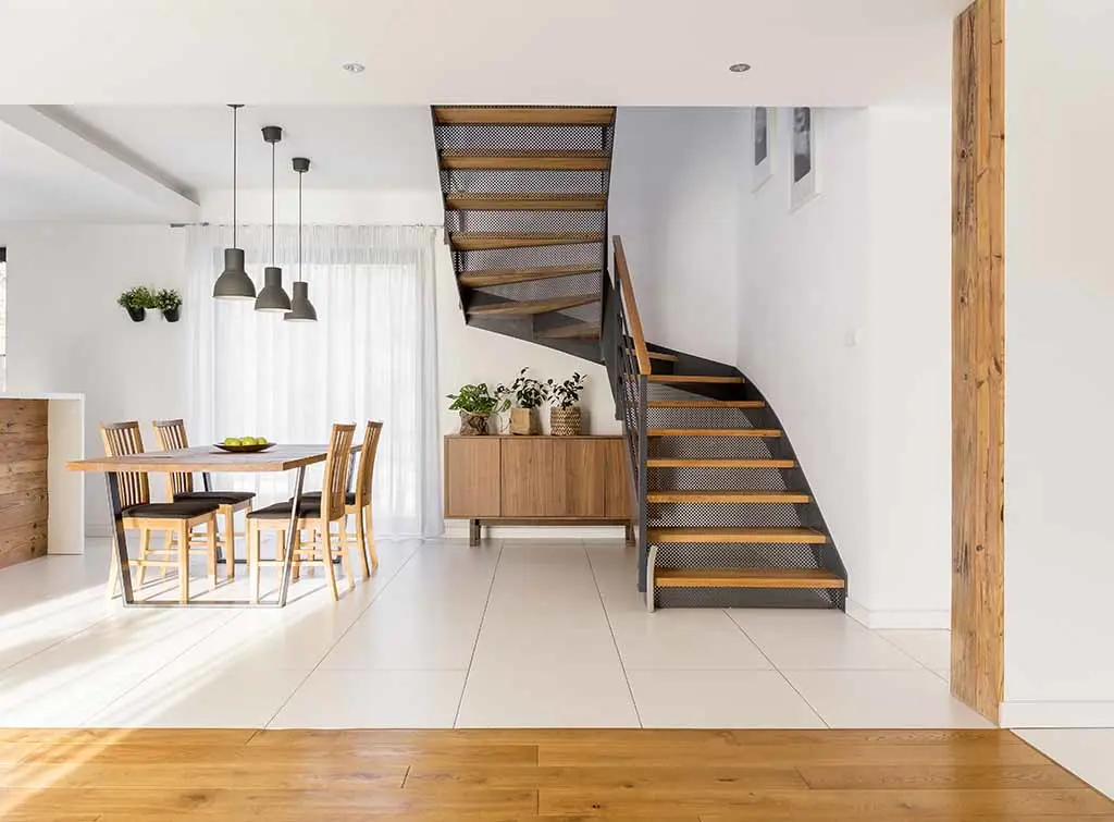 Open plan living metal and wood staircase