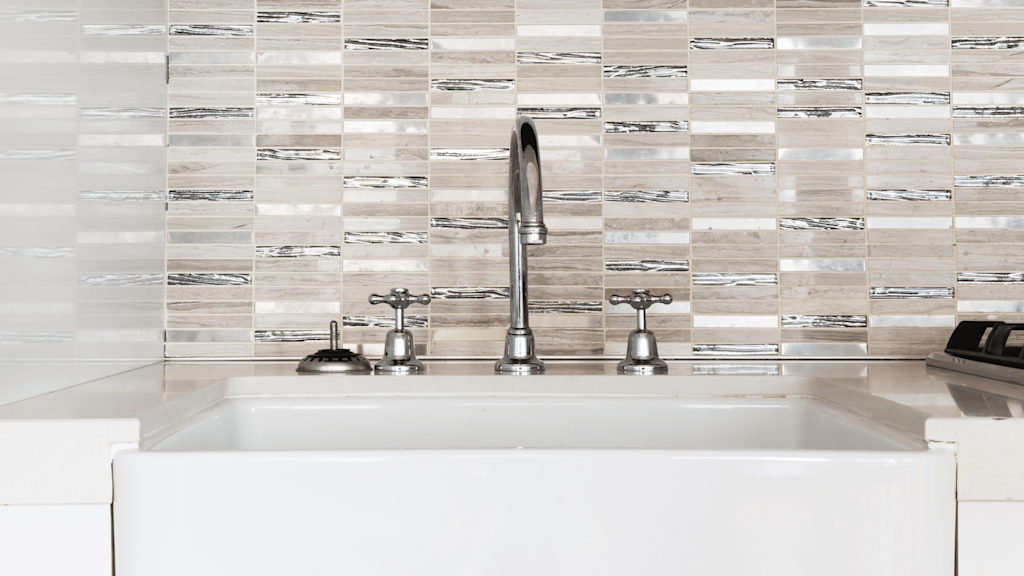 go for a luxe tiled splashback in a small bathroom