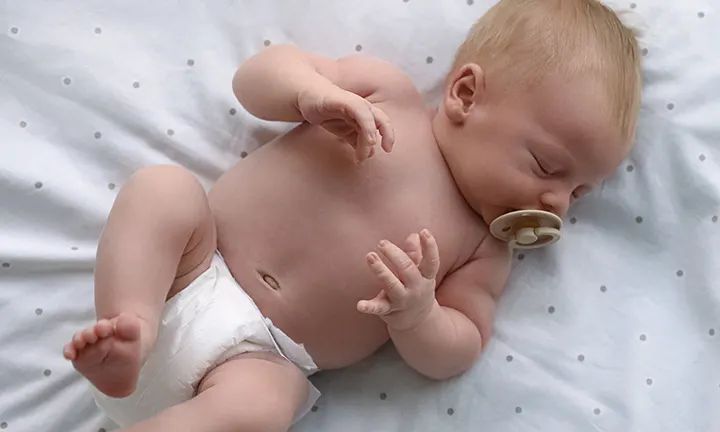 Newborn baby with a pacifier