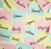 Multicolored post-it-notes with baby name suggestions on them