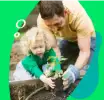 Sustainability- father and child planting