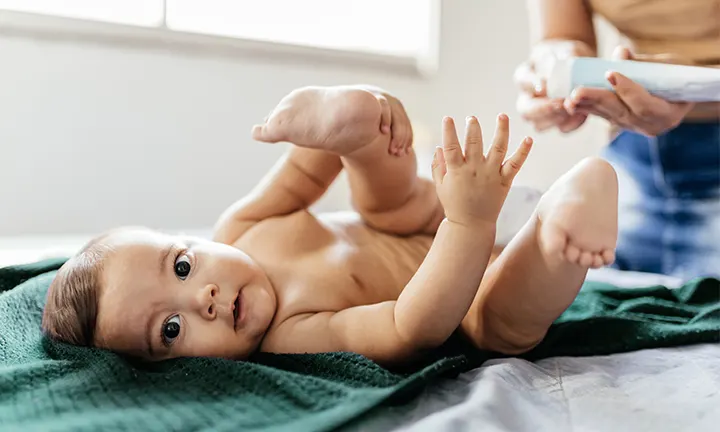  Baby lying on back during diapering