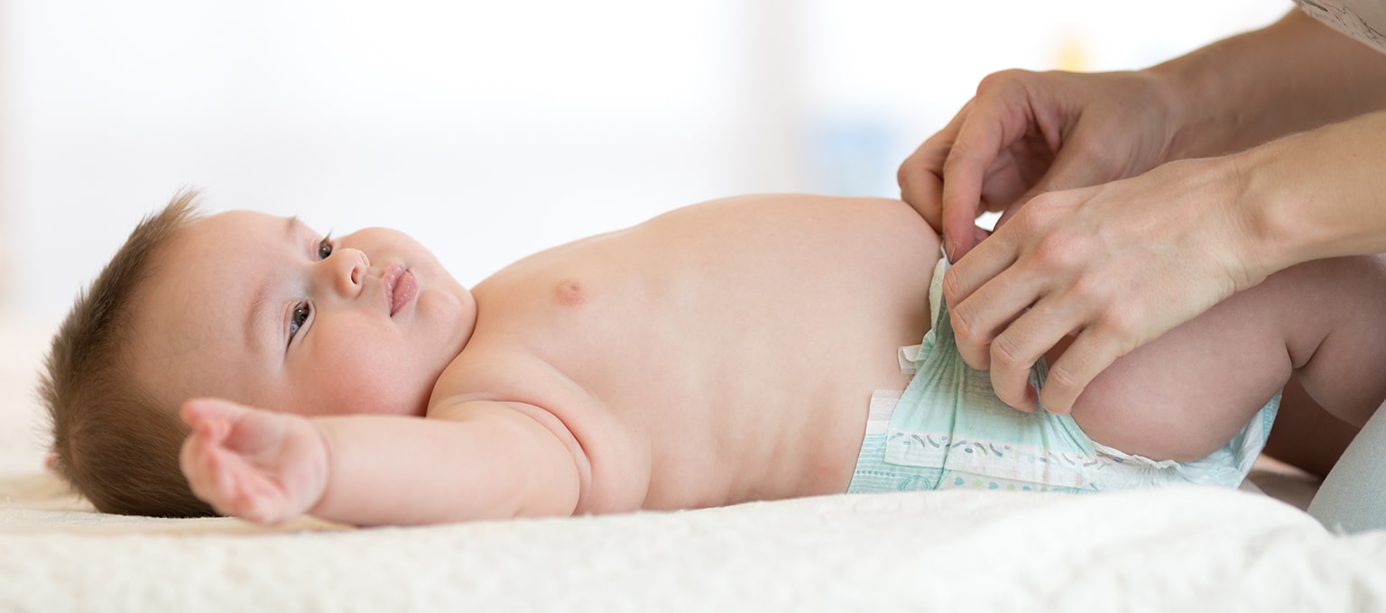 Baby rolling over store during diaper change