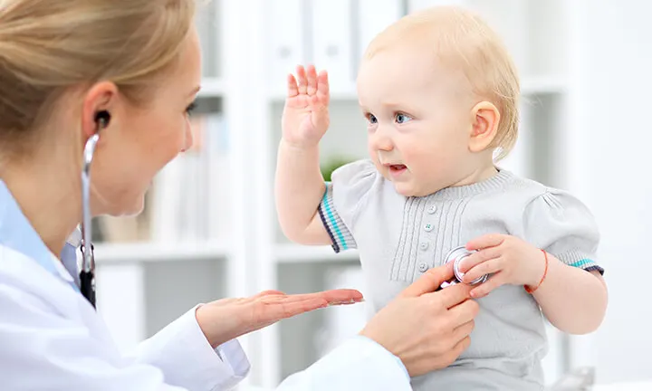 Doctor measuring baby head circumference. Pediatrician place