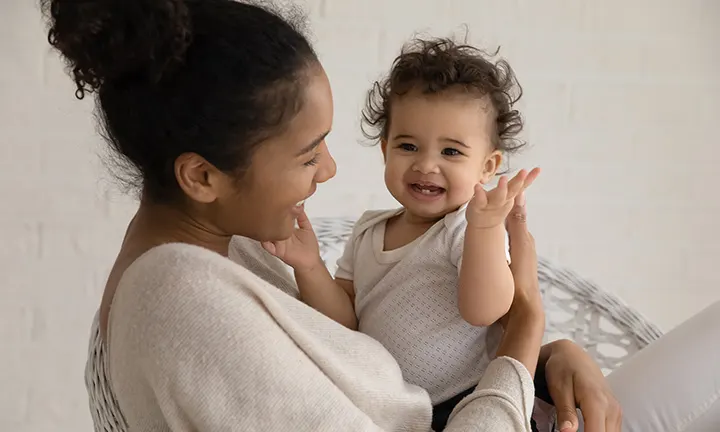 Mom playing with baby girl