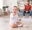 When do babies sit up?