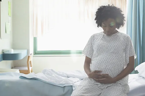 Woman dealing with labor pain, breathing exercises