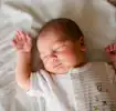 Baby sleeping quietly in a crib