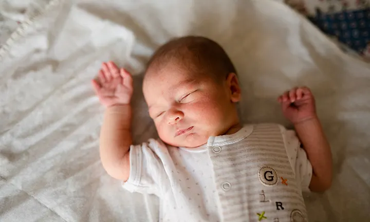 Baby sleeping quietly in a crib 