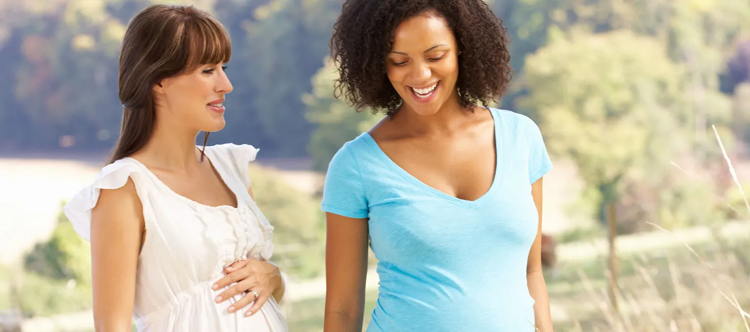 Two pregnant friends going for a walk