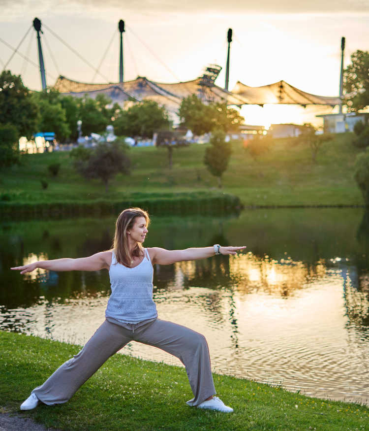 Alexandra Jacob in Warrior Yoga Pose in Olympiapark Munich