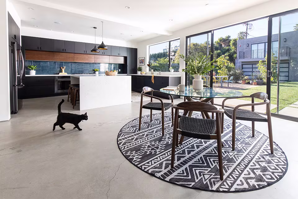 Ruggable Linear Aztec Black anbd White Round Rug Under Round Dining Table