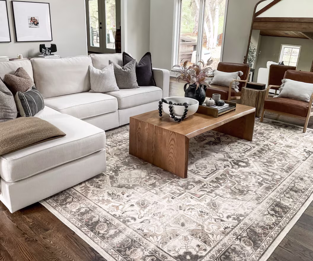 8x10 Kamran Hazel Rug in a light colored living room.