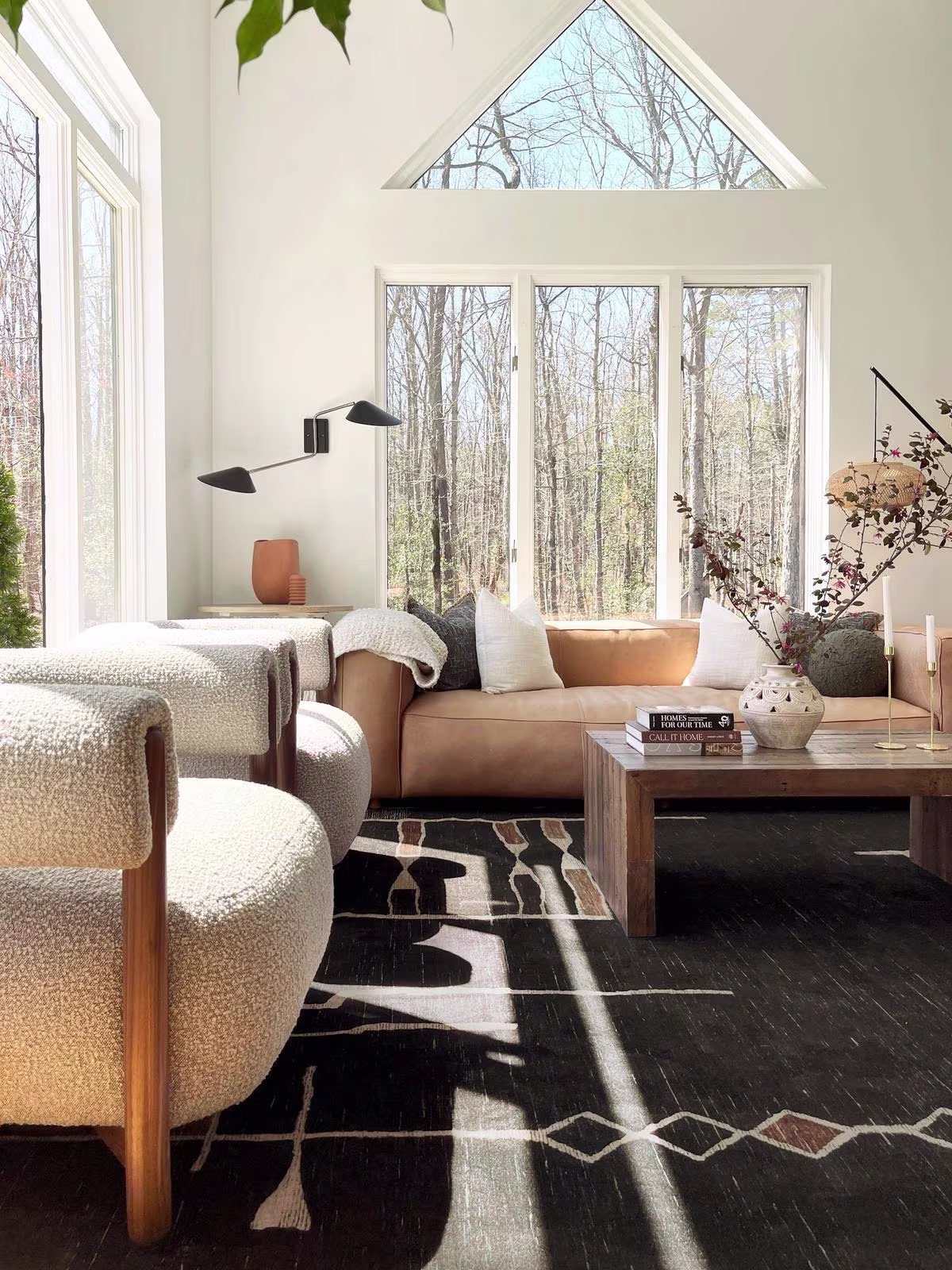 Architectural Digest Nisa Ink Black Rug in organic modern living room with natural light