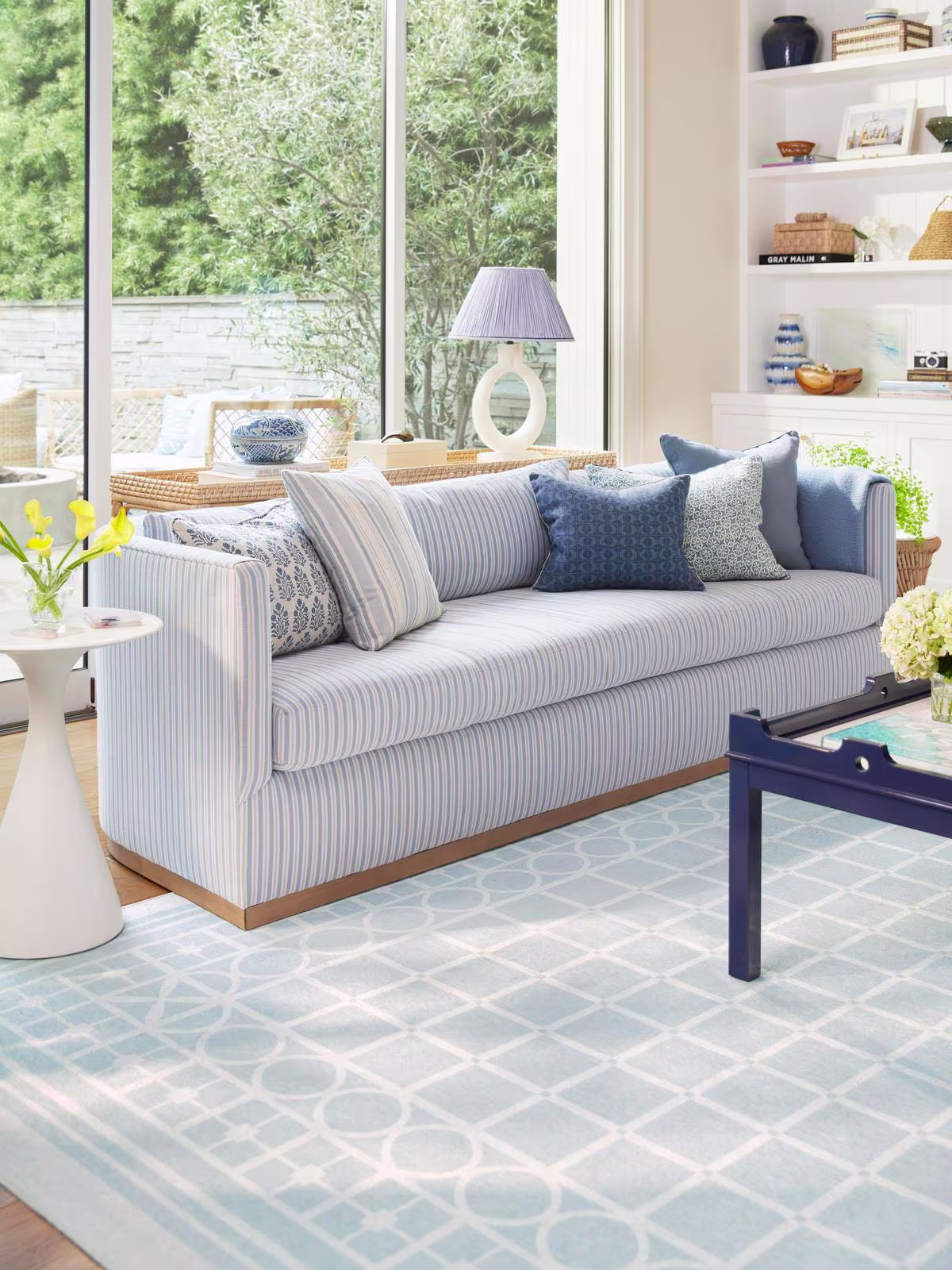 Ruggable x Gray Malin Palm Beach Powder Blue Rug in coastal living room with chinoiserie and rattan accents