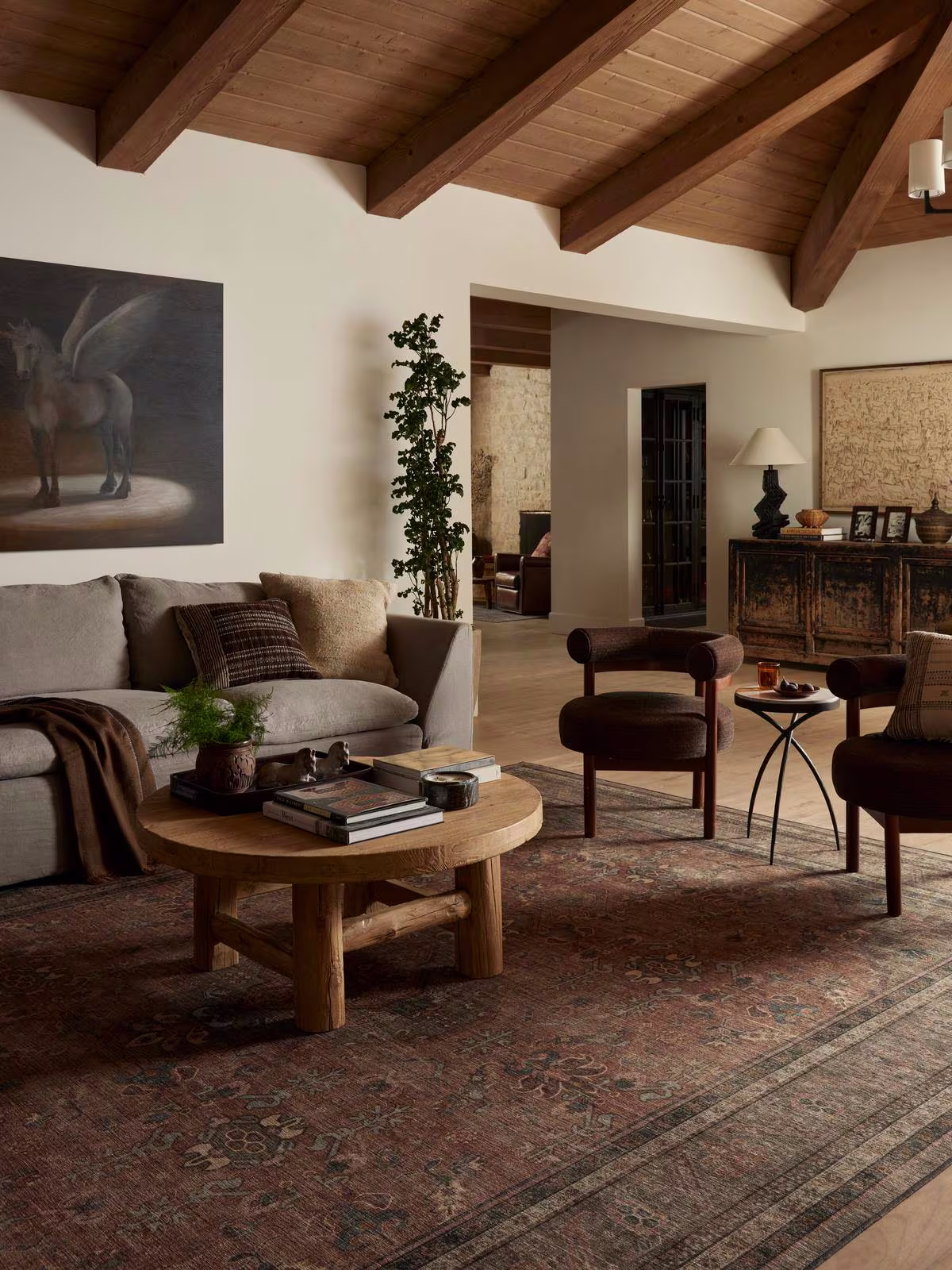 Cozy living room with warm wood furniture and brown tones with washable Rowan Stone & Soft Clay Rug.