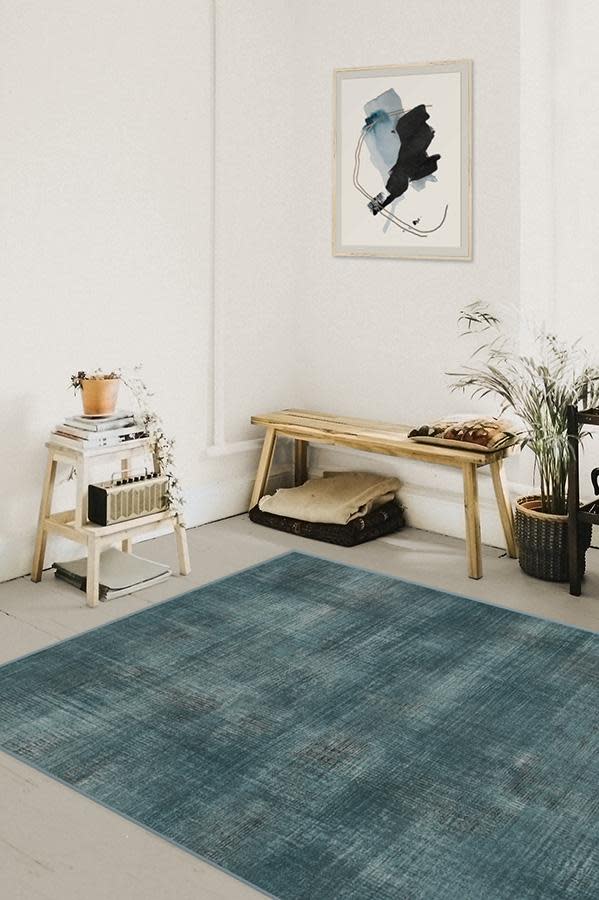 Room with Ruggable's Sudaria Solid Teal Blue Rug in 5x7